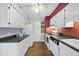 Well-lit kitchen with white cabinets, modern appliances, and plenty of counter space at 1200 Collington Dr, Cary, NC 27511