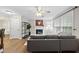 Cozy living room features a fireplace, ceiling fan, and large windows for natural light at 1200 Collington Dr, Cary, NC 27511