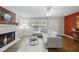Comfortable living room with modern decor, fireplace, and a view of the outdoors at 1200 Collington Dr, Cary, NC 27511