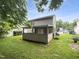 Backyard features a covered porch with green grass at 1216 Briarwood Dr, Mebane, NC 27302