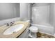 Cozy bathroom with granite-look vanity top and shower-tub combo with tiled walls at 1216 Briarwood Dr, Mebane, NC 27302