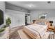 Modern bedroom features a neutral color palette, natural light, and stylish décor at 1216 Briarwood Dr, Mebane, NC 27302