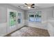Dining area features a window, door to the back, and ceiling fan at 1216 Briarwood Dr, Mebane, NC 27302