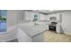 Modern kitchen with white cabinets, new appliances, and ample counter space at 1216 Briarwood Dr, Mebane, NC 27302