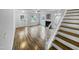 An open-concept living room features lots of natural light and stylish wood-look flooring at 1216 Briarwood Dr, Mebane, NC 27302