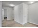 Spacious bedroom with plush carpeting, two closets, and convenient access to multiple rooms at 124 Teagarden Ct, Sanford, NC 27332
