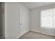 Cozy bedroom featuring soft carpet, natural light, and a door leading to another room at 124 Teagarden Ct, Sanford, NC 27332