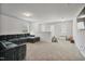 Upstairs bonus room with carpet, large sectional sofa, and space for recreation or entertaining at 124 Teagarden Ct, Sanford, NC 27332