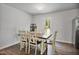 Dining area with a wood table and chairs with a door to the backyard at 124 Teagarden Ct, Sanford, NC 27332