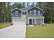 Charming two-story home featuring classic American architecture and a well-maintained lawn at 124 Teagarden Ct, Sanford, NC 27332
