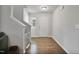 Bright foyer with hardwood floors, white walls, and staircase leading to the second floor at 124 Teagarden Ct, Sanford, NC 27332