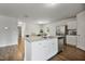 Open concept kitchen with stainless steel appliances, granite counters, and a breakfast bar at 124 Teagarden Ct, Sanford, NC 27332