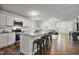 Bright, open kitchen with granite counters, stainless appliances, and island seating at 124 Teagarden Ct, Sanford, NC 27332