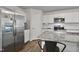 Kitchen with granite countertops, stainless steel appliances, and white cabinetry at 124 Teagarden Ct, Sanford, NC 27332