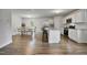 Modern kitchen with granite countertops, stainless steel appliances, and an island with bar stools at 124 Teagarden Ct, Sanford, NC 27332