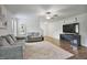 Spacious living room with hardwood floors, ceiling fan, and stylish furniture at 124 Teagarden Ct, Sanford, NC 27332