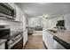 Bright, open living space with a kitchen featuring granite countertops and stainless steel appliances at 124 Teagarden Ct, Sanford, NC 27332