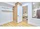 Clean storage room with shelves, and an open doorway leading to a finished basement at 126 Weaver Rd, Chapel Hill, NC 27514