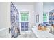 Bright bathroom with floral shower curtain and white vanity at 126 Weaver Rd, Chapel Hill, NC 27514