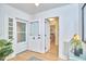 Bright foyer with white trim, hardwood floors, and a view into the bedroom at 126 Weaver Rd, Chapel Hill, NC 27514