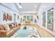 Spacious living room with modern furniture, a large rug, and an abundance of natural light at 126 Weaver Rd, Chapel Hill, NC 27514