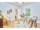 Bright office featuring hardwood floors, a glass desk, and a view into the bedroom at 126 Weaver Rd, Chapel Hill, NC 27514