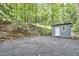 Outdoor shed with ample parking area, offering practical storage and utility space at 126 Weaver Rd, Chapel Hill, NC 27514