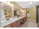 Bright bathroom with double vanity, jacuzzi tub and framed mirrors at 12636 Old Creedmoor Rd, Raleigh, NC 27613