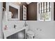 Charming half bathroom with modern sink, decorative mirror, and natural light at 12636 Old Creedmoor Rd, Raleigh, NC 27613