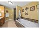 Bright bathroom with double vanity, jacuzzi tub and framed mirrors at 12636 Old Creedmoor Rd, Raleigh, NC 27613