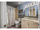 Stylish bathroom with a shower-tub combination and a modern vanity at 12636 Old Creedmoor Rd, Raleigh, NC 27613