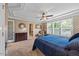Bedroom with large windows, trey ceiling, and en-suite bathroom with double vanity at 12636 Old Creedmoor Rd, Raleigh, NC 27613