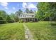 Beautiful two-story home with a stone pathway leading to the front entrance at 12636 Old Creedmoor Rd, Raleigh, NC 27613