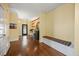 Inviting foyer with hardwood floors, decorative lighting, and an accent wall at 12636 Old Creedmoor Rd, Raleigh, NC 27613