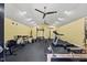 Home gym featuring updated floors, lighting, and fitness equipment at 12636 Old Creedmoor Rd, Raleigh, NC 27613