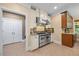 A well-equipped kitchen features stainless steel appliances and ample counter space at 12636 Old Creedmoor Rd, Raleigh, NC 27613