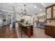 Kitchen with an island, stainless steel appliances, and ample counter space at 12636 Old Creedmoor Rd, Raleigh, NC 27613
