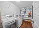 Functional laundry room with modern washer and dryer, and plenty of storage space at 12636 Old Creedmoor Rd, Raleigh, NC 27613