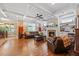 Cozy living room with a fireplace, hardwood floors, and coffered ceiling at 12636 Old Creedmoor Rd, Raleigh, NC 27613