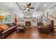 Living room with a fireplace, hardwood floors, coffered ceiling and abundant natural light at 12636 Old Creedmoor Rd, Raleigh, NC 27613