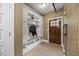 Well-organized mudroom with built-in storage, a bench, and coat hooks at 12636 Old Creedmoor Rd, Raleigh, NC 27613