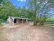 Well-lit barn with multiple stalls, providing comfortable housing for horses and livestock at 12823 Summerwind Trl, Rougemont, NC 27572