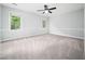 Spacious bedroom features large windows and a neutral carpet and wall color at 12823 Summerwind Trl, Rougemont, NC 27572