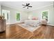 Spacious bedroom with hardwood floors, ensuite bathroom, and plenty of natural light at 12823 Summerwind Trl, Rougemont, NC 27572