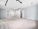 Large bonus room with neutral carpet, track lighting, and a window providing natural light at 12823 Summerwind Trl, Rougemont, NC 27572