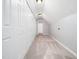 Hallway with carpet, multiple closets, and white trim at 12823 Summerwind Trl, Rougemont, NC 27572