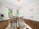 Bright office featuring hardwood floors, a desk and a natural rug at 12823 Summerwind Trl, Rougemont, NC 27572