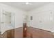 Bedroom with hardwood floors, generous closet space, and access to an adjacent bath at 1310 Durlain Dr # 107, Raleigh, NC 27614