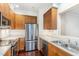 Modern kitchen featuring stainless steel appliances, hardwood floors, and bright countertops at 1310 Durlain Dr # 107, Raleigh, NC 27614