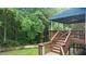 Lovely deck and stairs, surrounded by lush trees, creating a cozy outdoor retreat at 1332 Kinsdale Dr, Raleigh, NC 27615